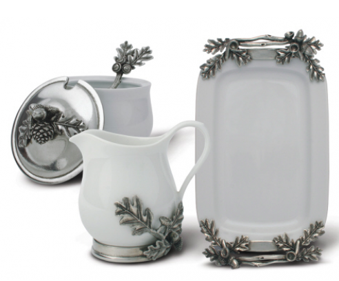 Wintery white porcelain accented with elegant silvery pewter oak leaves and acorns creates an elegant presentation for cream and sugar.